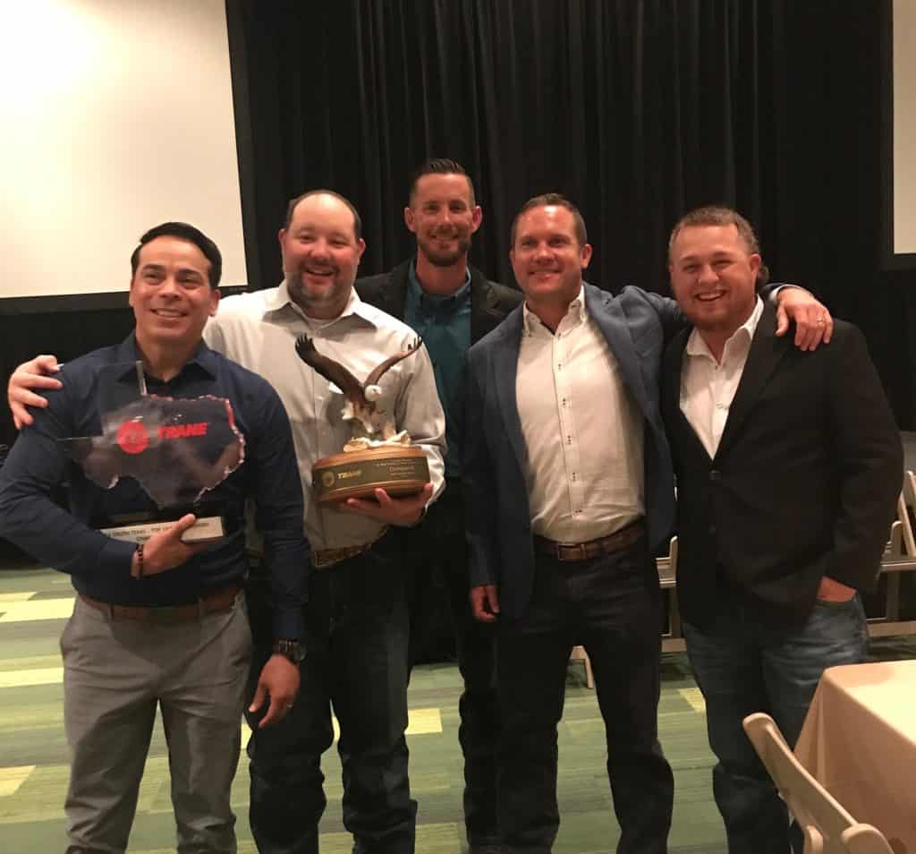 Champion Home Services Team receiving Trane Top Ten Conference Growth Dealer award